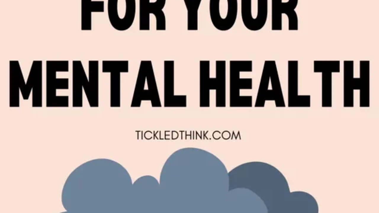 Close up on a plate of mashed potatoes, topped with baked pork chops with cream of mushroom soup, and a side of green beans.