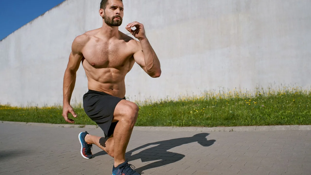 Two mint chocolate milkshakes with whipped cream and green sprinkles.