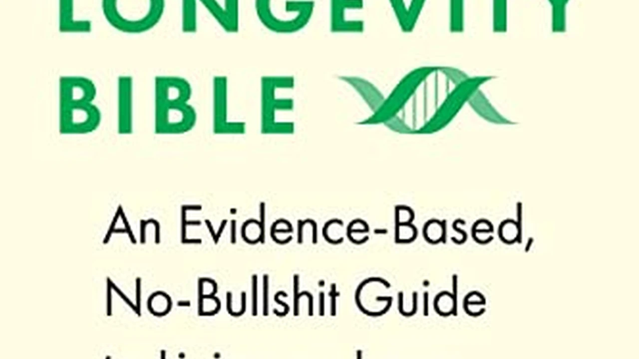 Close up on a plate of mashed potatoes, topped with baked pork chops with cream of mushroom soup, and a side of green beans.